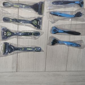 NEW 4 Yellow and 4 Blue DORCO handles and over 150 extra Razors
